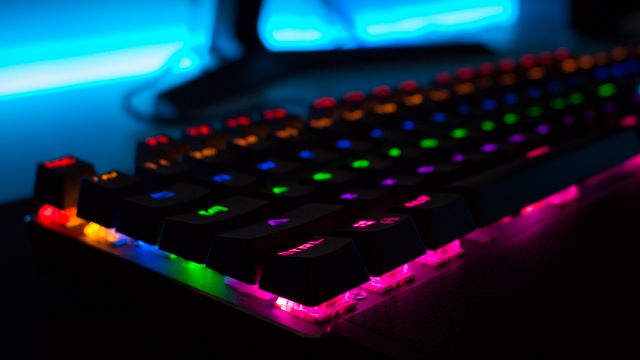 A mechanical keyboard glowing in Red Blue and Green color